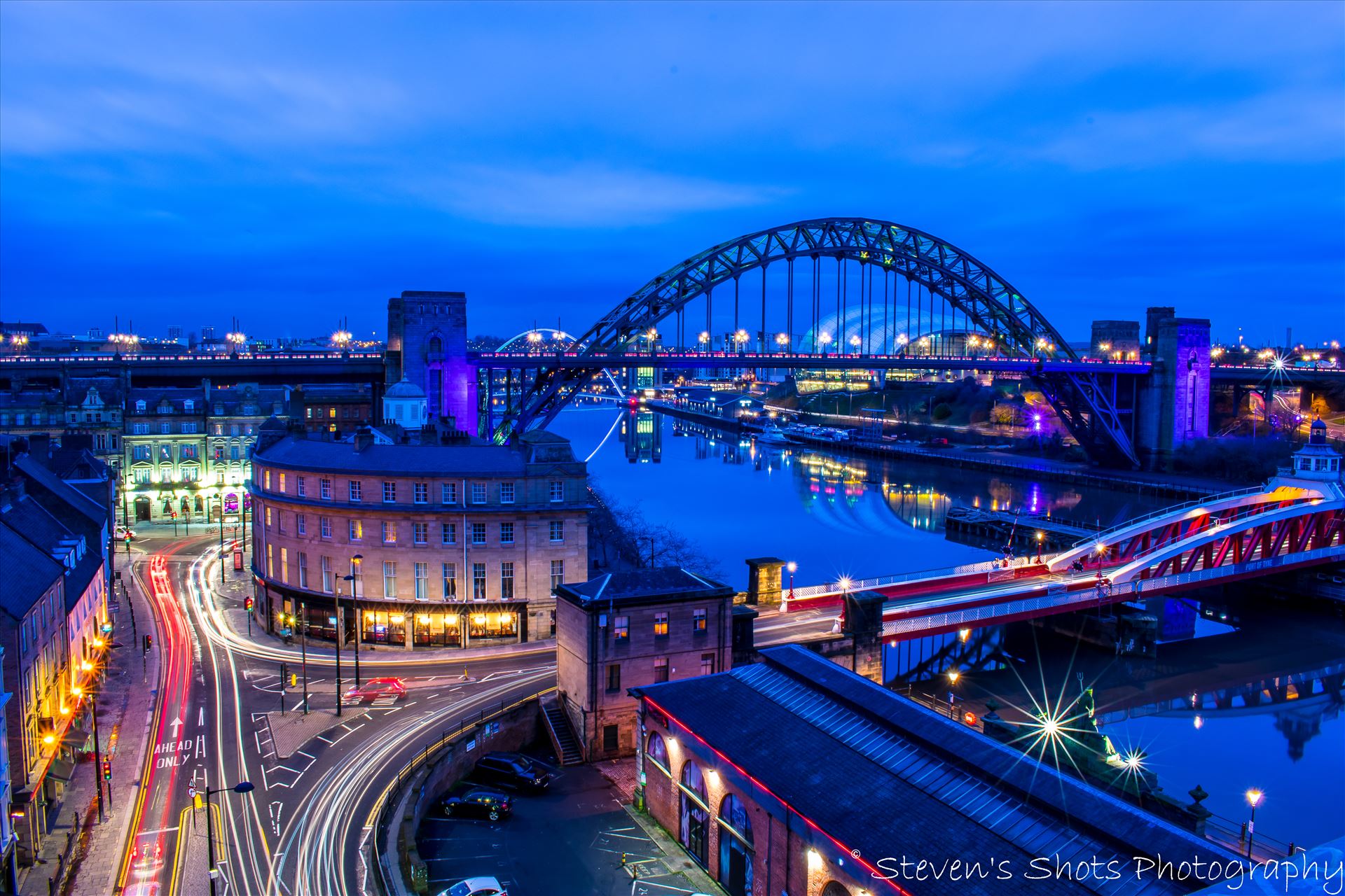 Swing Bridge and Tyne Bridge with traffic on the quayside - A long exposure shot from the high level bridge in Newcastle, showing the Tyne Bridge and Swing Bridge with traffic down on the quayside. by Steven's Shots Photography